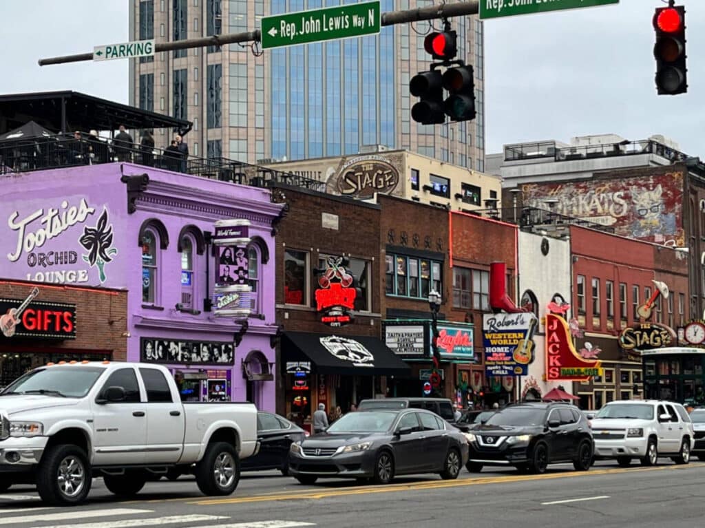 The Tootsies Orchid Lounge and cars passing by it in Downtown Nashville