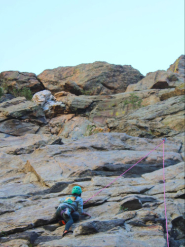 Abigail Bliss climbing to the top of the route in Clear Creek Canyon