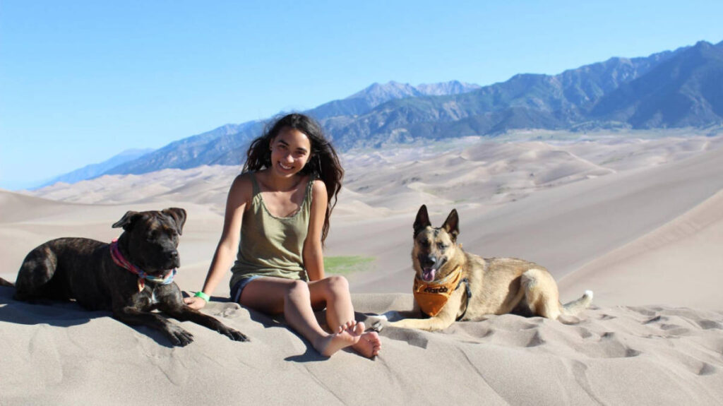 The author, Abigail Bliss with her dogs at the Great Sand Dunes National Park