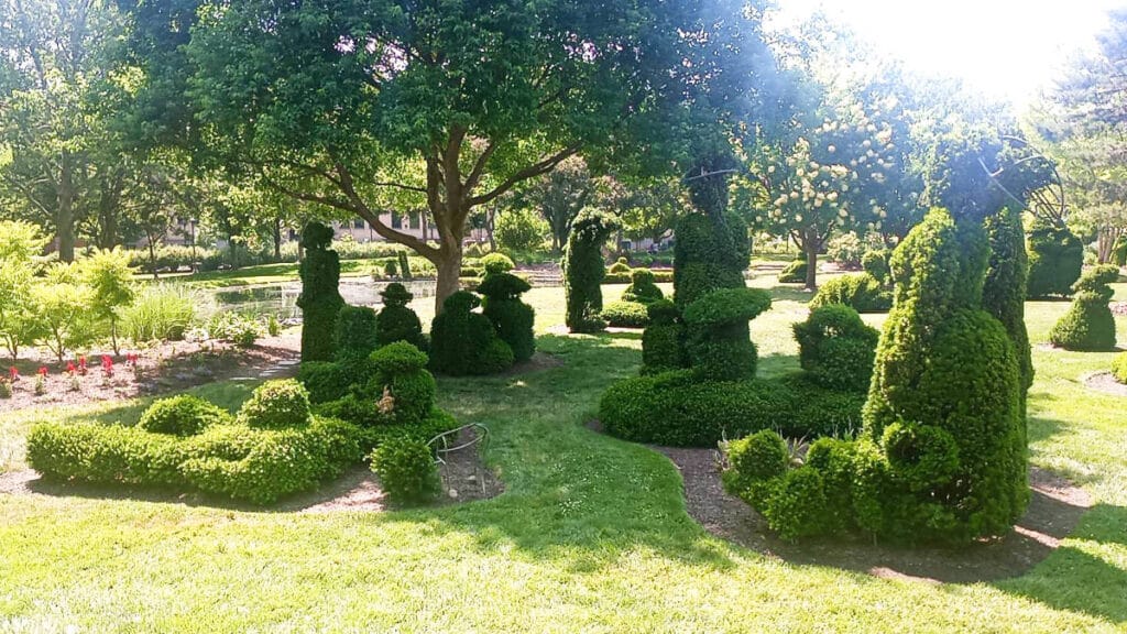 View of the topiaries recreating “A Sunday Afternoon on the Island of La Grande Jatte” at the garden of Topiary Park