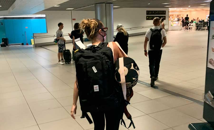 The author carrying her Topo Designs Travel Bag in Lisbon Airport