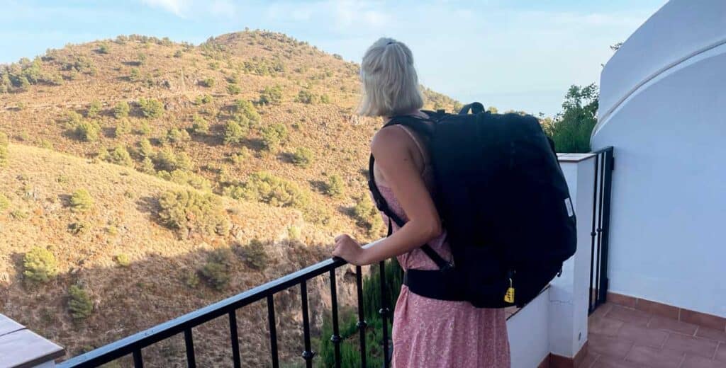 The author of the post Sky Ariella with the Topo Designs Global Travel bag, overlooking a hillside