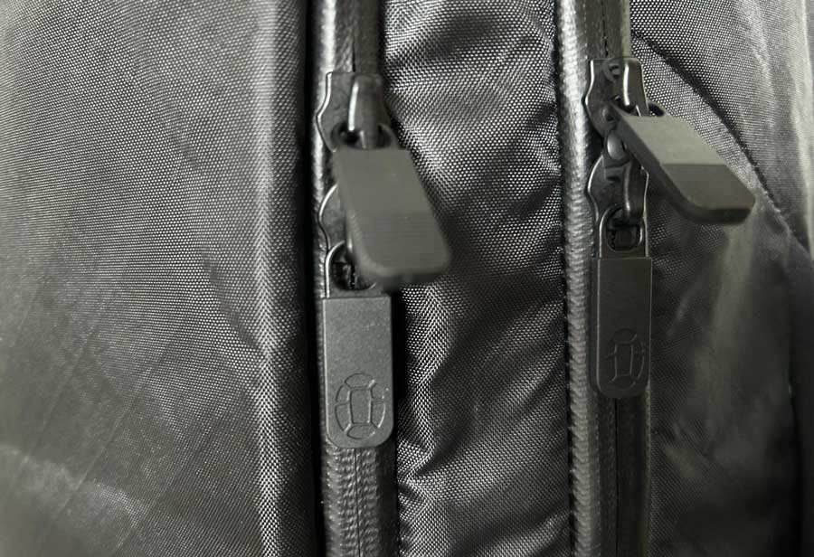 Close up view of the YKK zippers of the Tortuga Travel Backpack