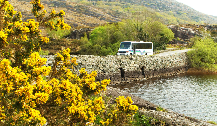 View of a tourist bus crossing a small bridge