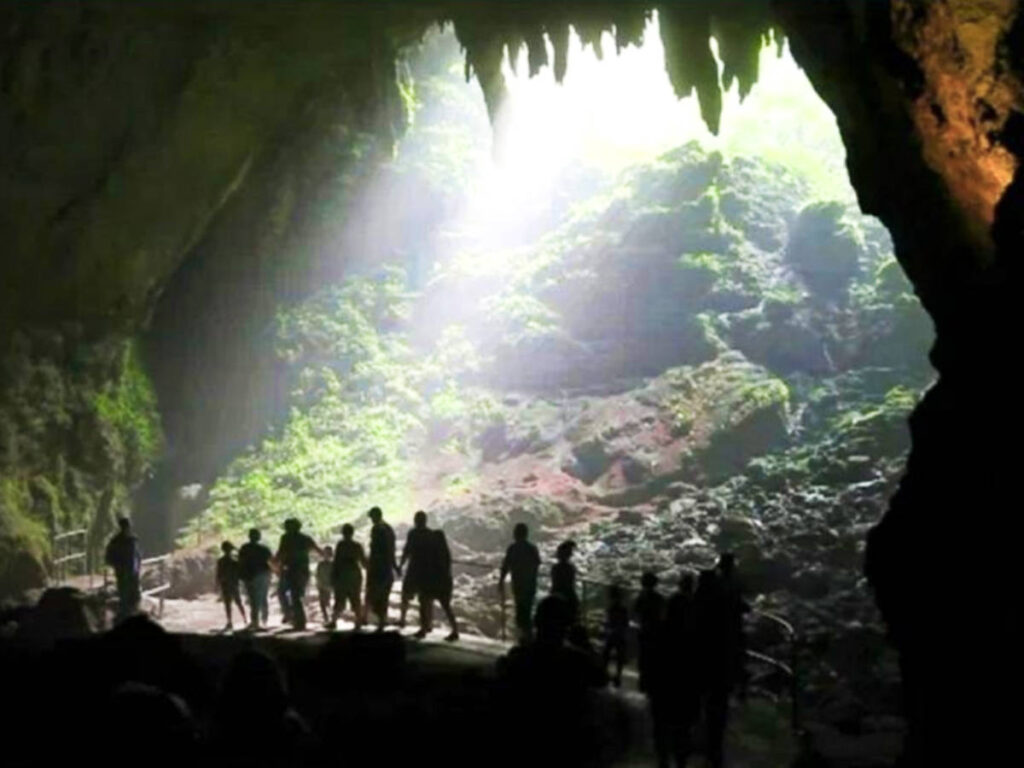 A group of tourists exploring the cave
