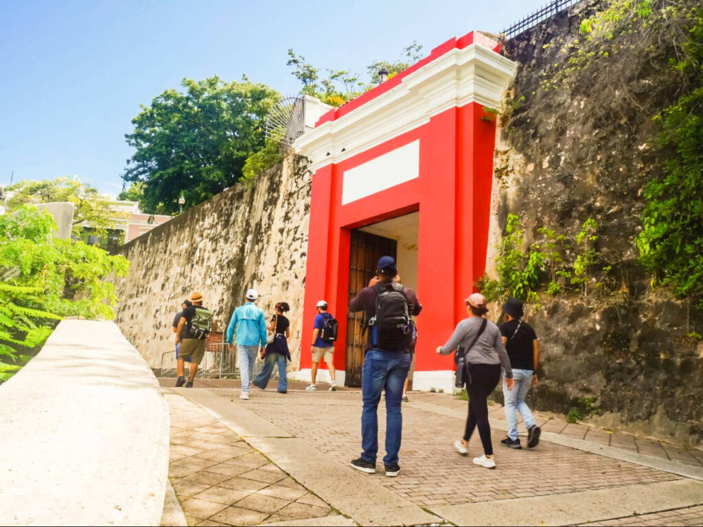 The tourists walking along the street of Old San Juan