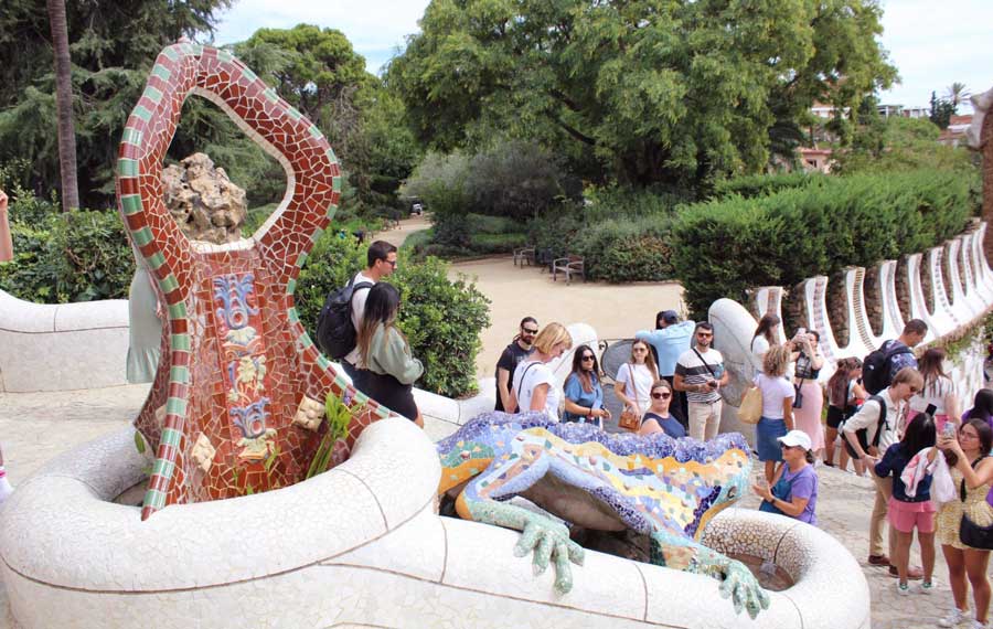 View of tourists visiting Park Guell during summer season