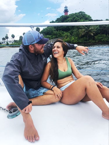 The author and his wife on a boat and the Jupiter Inlet Lighthouse on their background