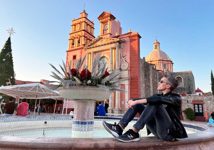 The author sitting near a fountain in Tequis, Querétaro