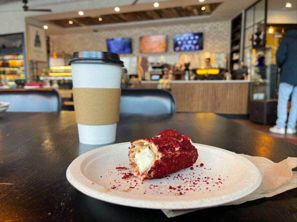 View of the latte and cannoli from Tradesman Coffee Shop
