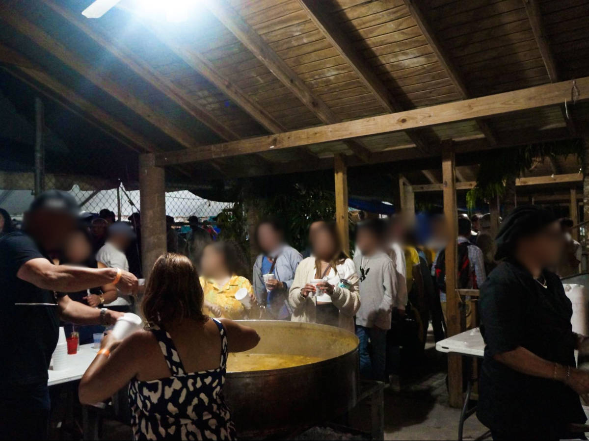 Crowd lining up for a cup of traditional asopao