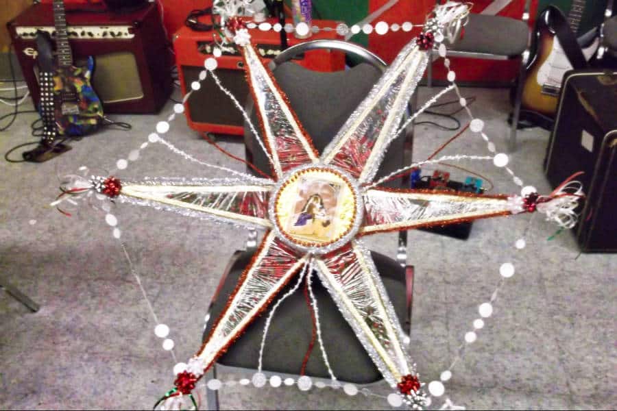 A traditional Christmas star displayed on a chair