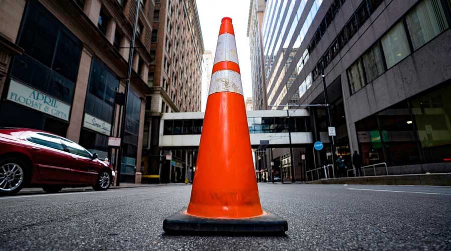A traffic cone on a street in Cincinnati Downtown