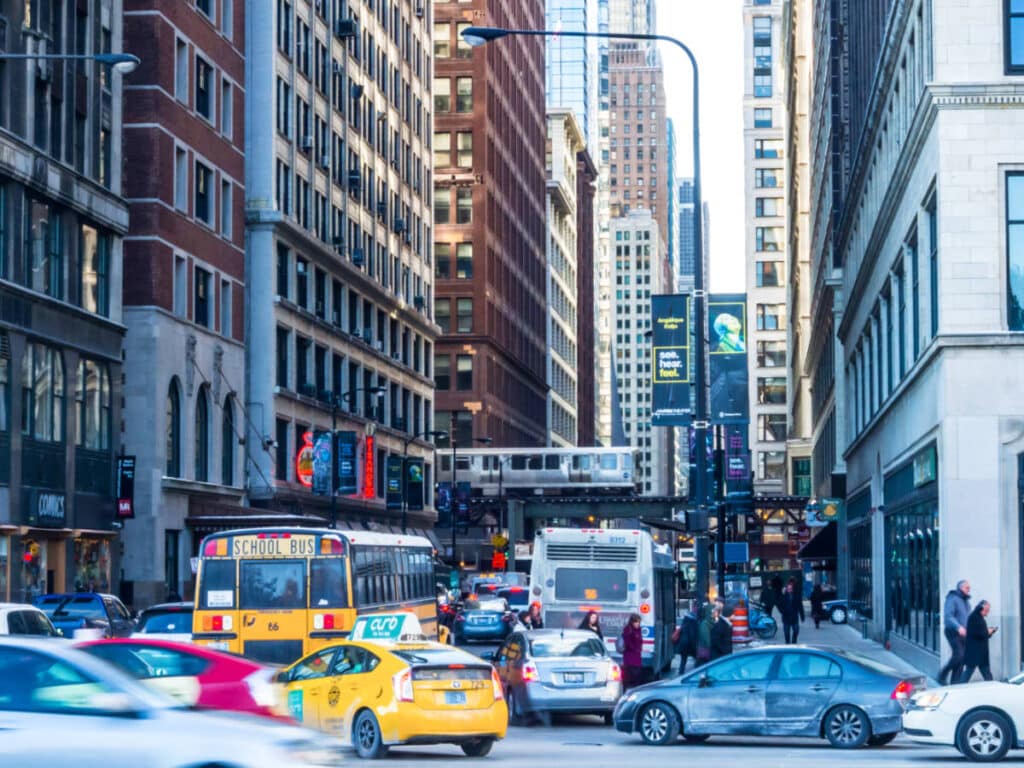 View of the traffic in the middle of the tall buildings in the Loop