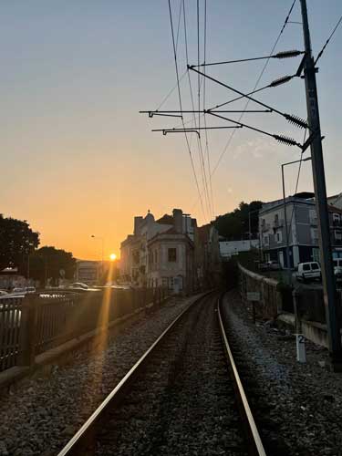 View of sunset from a train track in Setubal