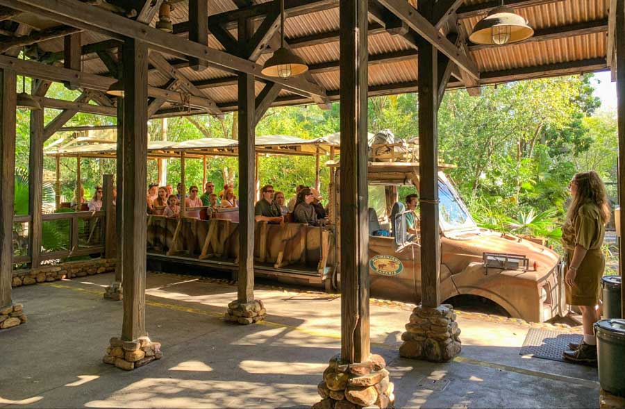 People riding a tram during a tour in Disney's Animal Kingdom