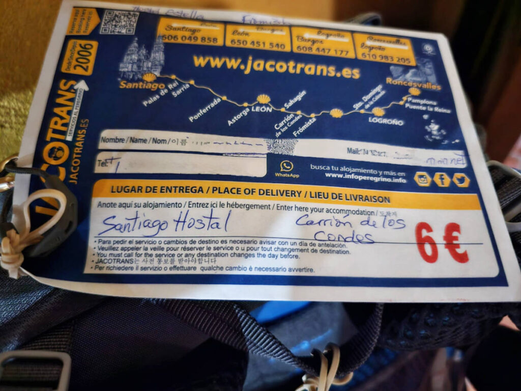 A bag transfer envelope on a backpack
