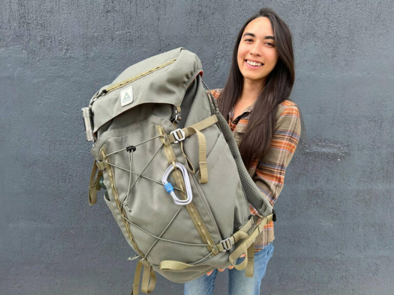 Travel Lemming author Abigail Bliss holding her Salkan Carry-On Backpack