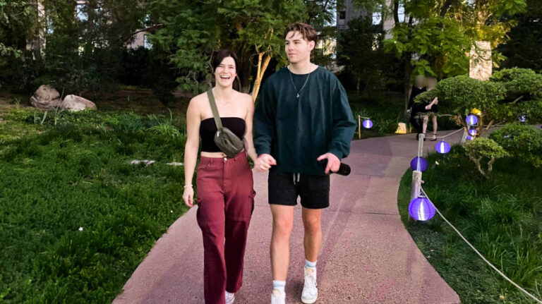 The author Betty Hurd and her boyfriend walking in a garden