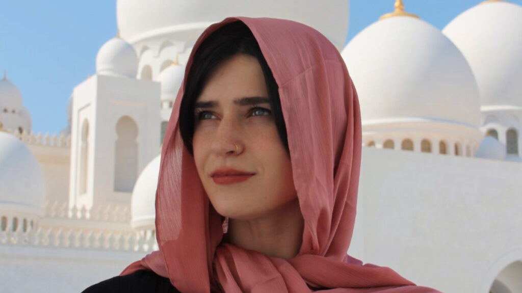 Travel Lemming author Betty wearing a pink headscarf in Sheikh Zayed Grand Mosque