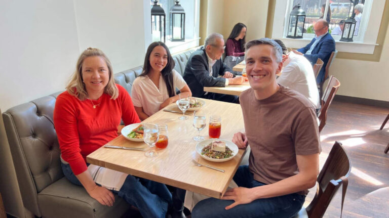 The author, Laura Falin with Travel Lemming's Founder Nate Hake, and Editor Abigail Bliss at Mercantile Dining & Provision