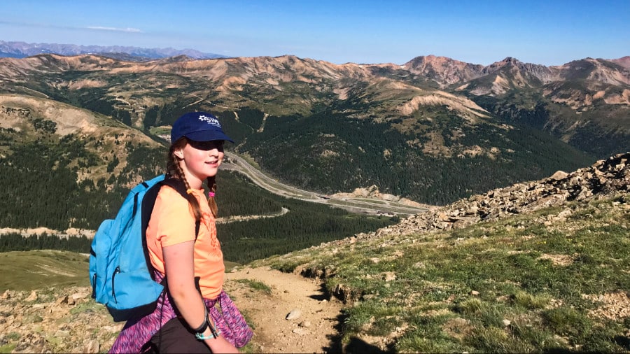 A girl striking a pose on one of the hiking trails in Colorado