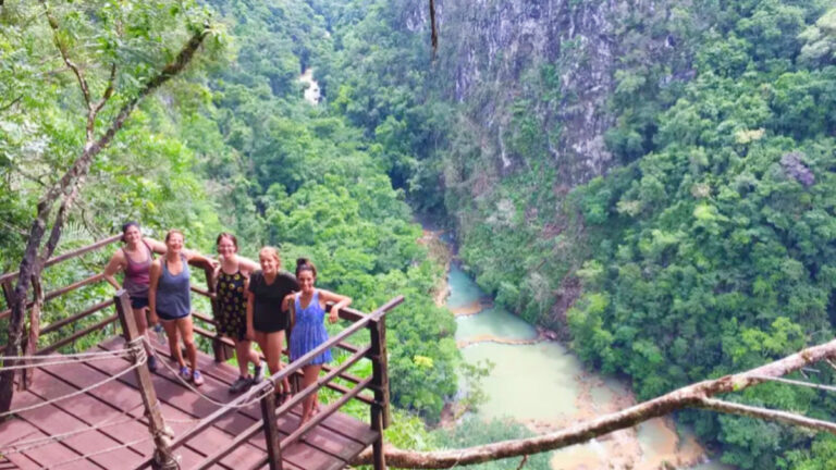 The author and her friends posing for a photo in a view deck at Semuc Champey