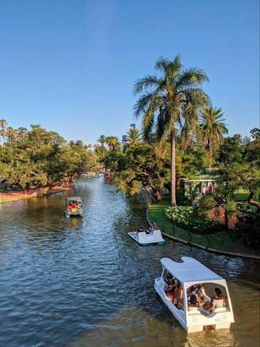 View of people riding a boat in Tres de Febrero Park