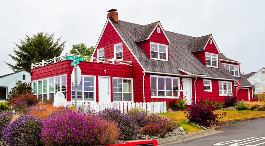 A bright red exterior view of Trinidad Bay Bed & Breakfast Hotel in Trinidad, California