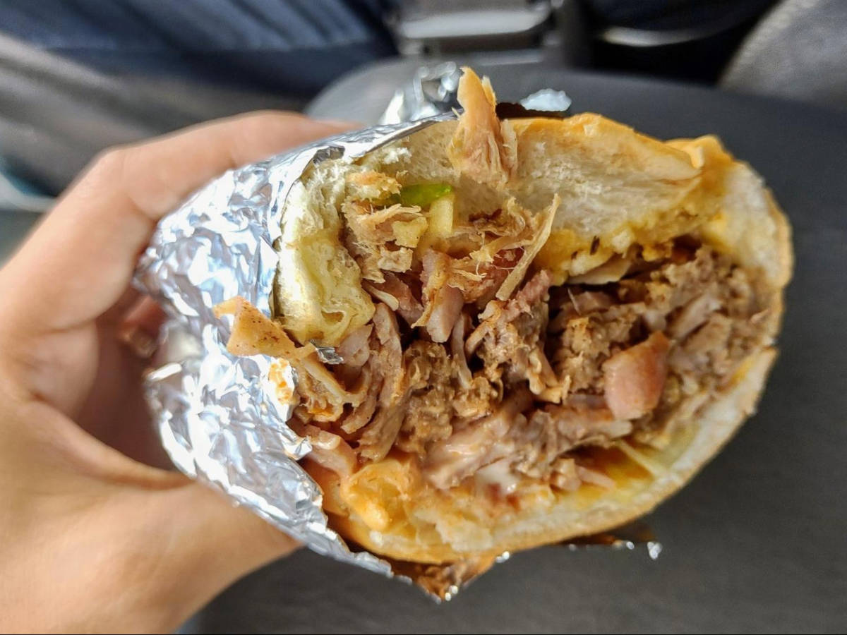 Closeup look of a sandwich with shredded roasted pork