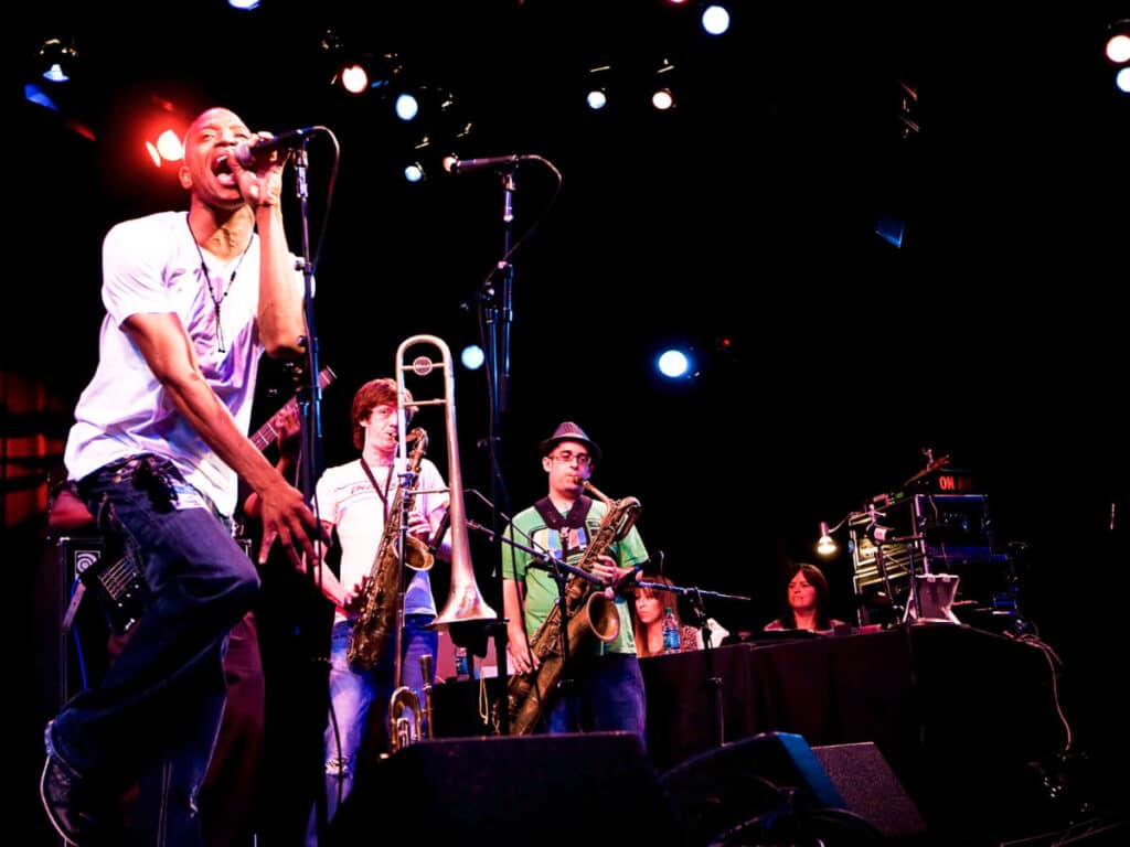 View of the Trombone Shorty & Orleans Avenue performing on stage