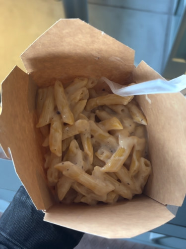 Truffle pasta in a takeout box at Mercado do Bolhão
