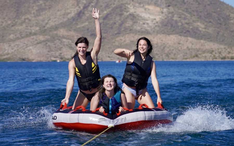 The author with her friends tubing race at Lake Pleasant
