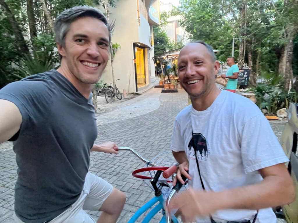 The author, Nate Hake with a friend biking in Tulum’s Aldea Zama area