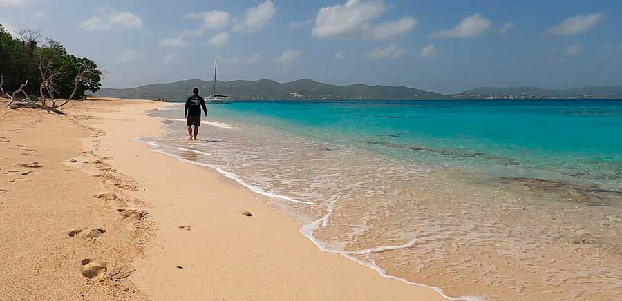 The author walking on the shoreline of Turtle Beach