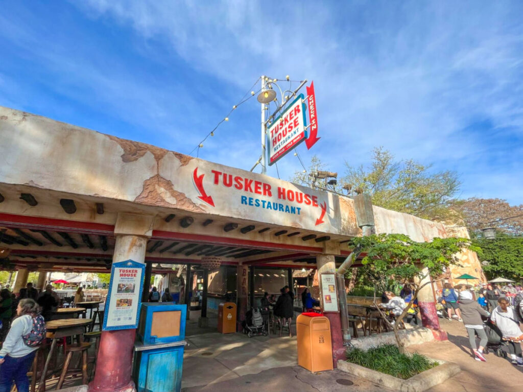 Entrance of the Tusker House Restaurant with people dining in