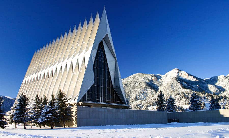 View of the snow covered US Air Force Academy Cadet Chapel with a clear blue sky in the background