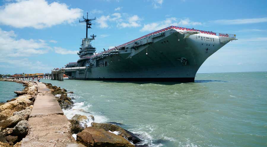 The USS Lexington on the water of Texas under the clear blue sky
