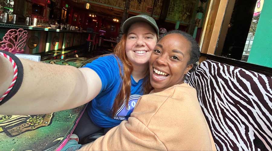 The author with her friend smiling for a photo in Unicorn