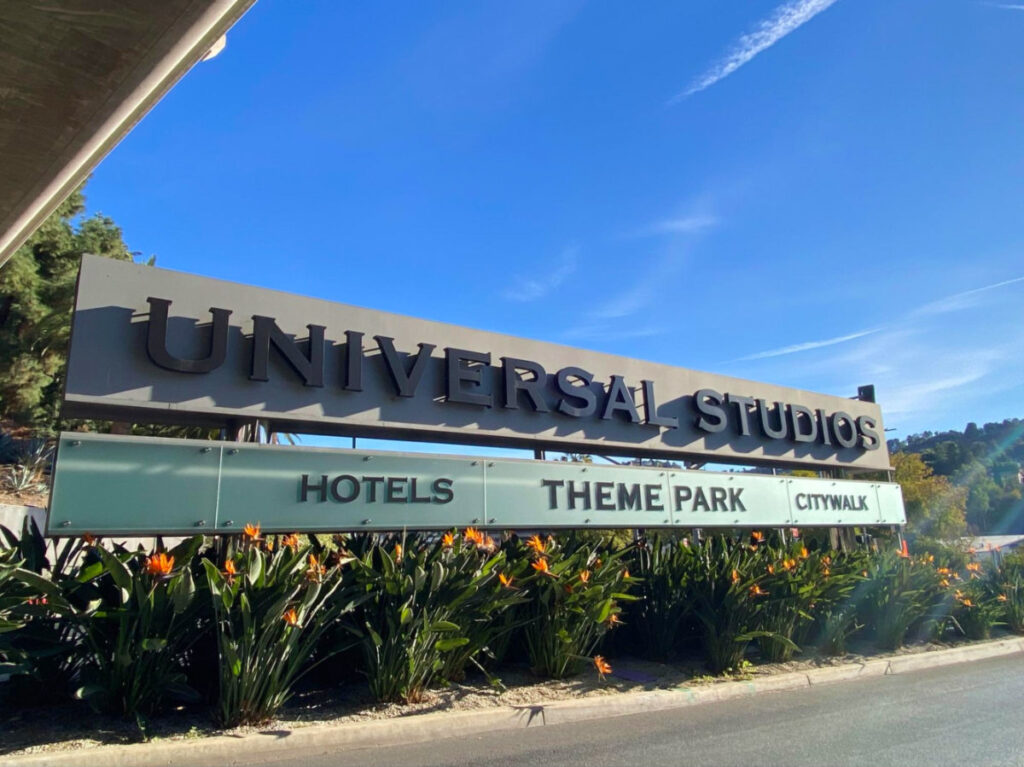 Signage of Universal Studios Hollywood, featuring the park's name and services