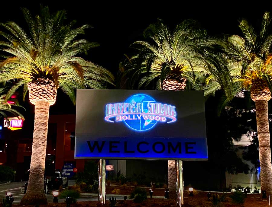 View of the Universal Studios Hollywood logo on a screen at the entrance to the parking area of CityWalk