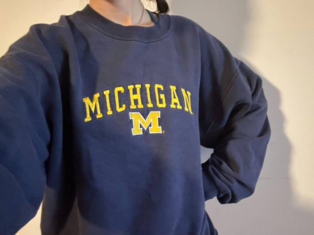 The author, Lea Rose Allbaugh wearing a University of Michigan sweatshirt