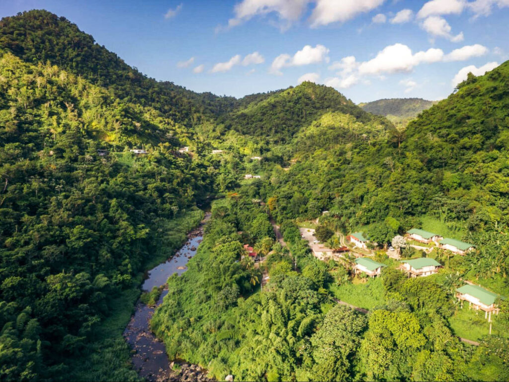Aerial view of the Casa Grande Mountain Retreat overlooking the river on the Utuado Valley
