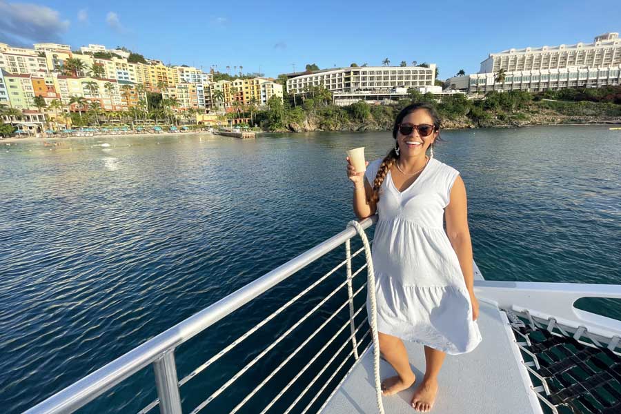 The author's wife posing for a photo with the Frenchmans Cove at the background