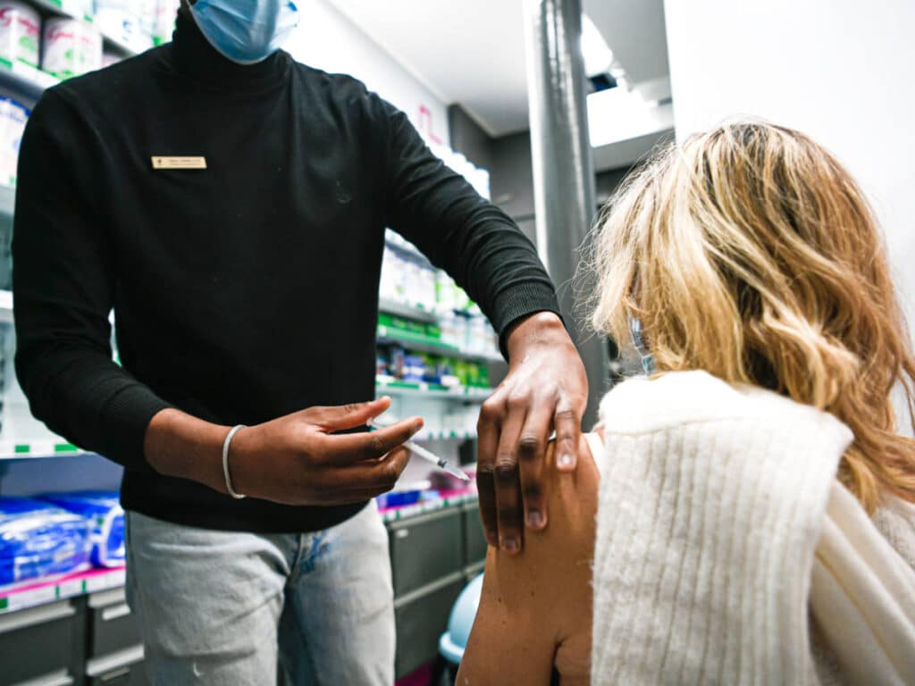 A woman getting vaccinated