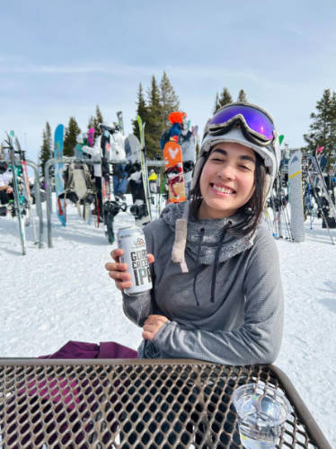 The author, Abigail Bliss holding a canned beer from Vail Brewing Co. at the Vail Ski Resort