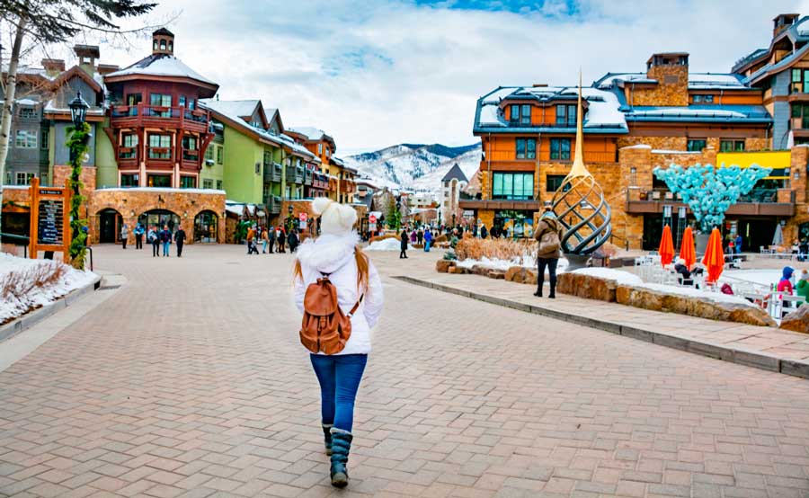 People in a small town village in Vail during winter