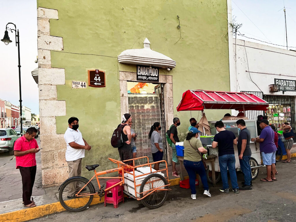 People lining up on a food cart in Valladolid