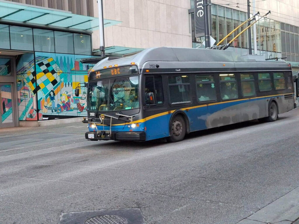 A bus travels along a street in Vancouver 