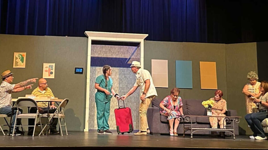 The author Vanessa Ramos participating in a play with her co-actors in Teatro Luis M. Arcelay
